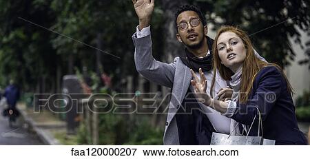Couple waiting for taxi View Large Photo Image Stock Photo - Couple waiting for taxi. Fotosearch