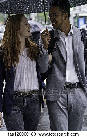 Couple walking on street View Large Photo Image Stock Image - Couple walking on street. Fotosearch