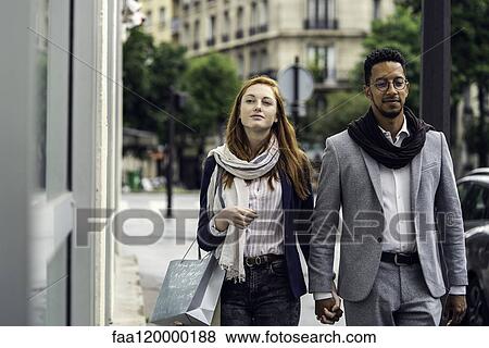 Stock Photo - Couple walking outdoors. Fotosearch