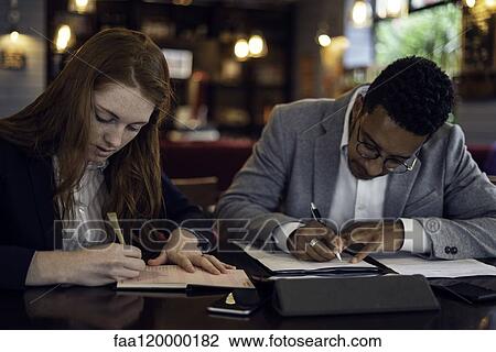 Couple working in caf View Large Photo Image Stock Image - Couple working in caf. Fotosearch