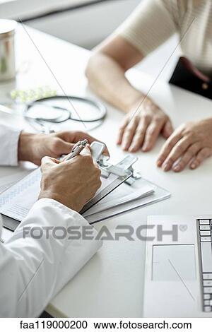 Doctor writing prescription View Large Photo Image Stock Image - Doctor writing prescription. Fotosearch
