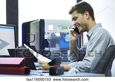 Engineer talking on smart phone View Large Photo Image Stock Image - Engineer talking on smart phone. Fotosearch