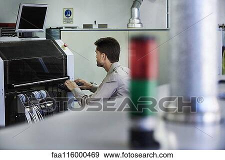 Engineer using computer in office View Large Photo Image Stock Photo - Engineer using computer in office. Fotosearch