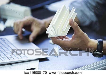 Engineer using laptop in office View Large Photo Image Stock Image - Engineer using laptop in office. Fotosearch
