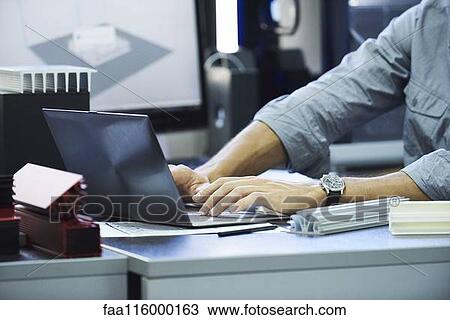 Engineer using laptop View Large Photo Image Stock Image - Engineer using laptop. Fotosearch