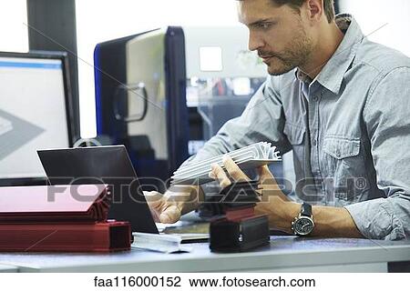 Engineer working in office View Large Photo Image Stock Image - Engineer working in office. Fotosearch