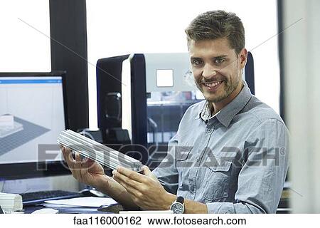 Engineer working in office View Large Photo Image Stock Image - Engineer working in office. Fotosearch