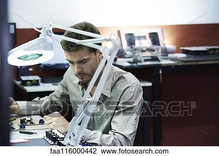 Engineer working in office View Large Photo Image Stock Image - Engineer working in office. Fotosearch
