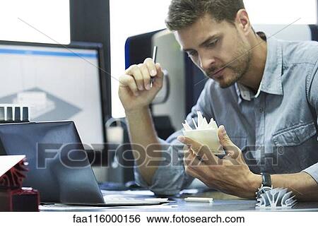 Engineer working in office View Large Photo Image Stock Photograph - Engineer working in office. Fotosearch
