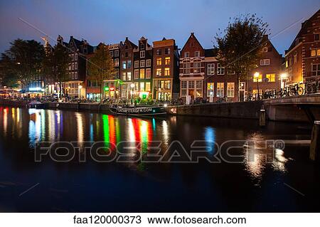 Exterior of residential buildings near canal View Large Photo Image Stock Image - Exterior of residential buildings near canal. Fotosearch