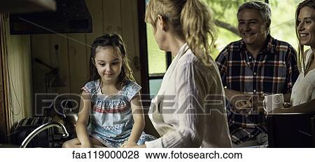 Family talking in kitchen View Large Photo Image Stock Photo - Family talking in kitchen. Fotosearch