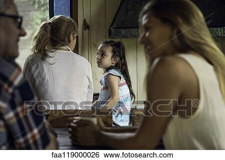 Stock Photograph - Family talking in kitchen. Fotosearch