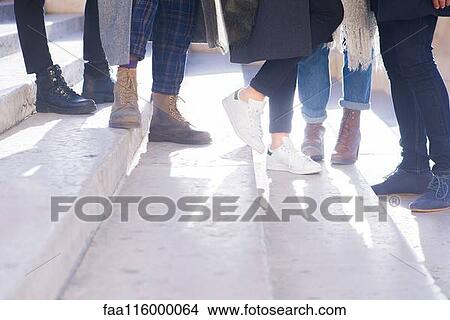 Friends standing on steps View Large Photo Image Picture - Friends standing on steps. Fotosearch