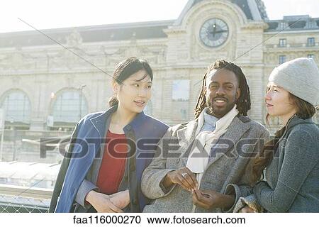 Friends standing together in boat View Large Photo Image Stock Image - Friends standing together in boat. Fotosearch