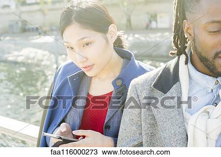 Friends standing together in boat View Large Photo Image Stock Image - Friends standing together in boat. Fotosearch