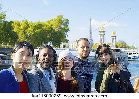 Friends standing together in boat View Large Photo Image Stock Photo - Friends standing together in boat. Fotosearch