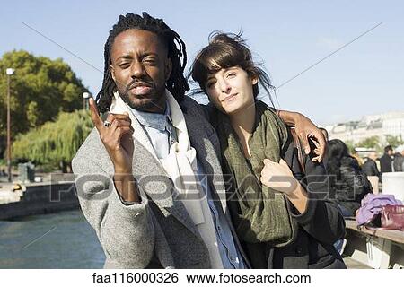 Friends standing together in boat View Large Photo Image Stock Photograph - Friends standing together in boat. Fotosearch