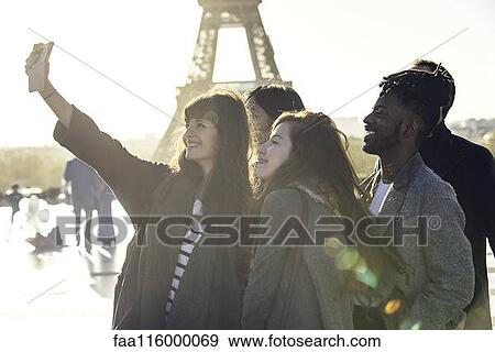 Friends taking selfie with smart phone View Large Photo Image Stock Photo - Friends taking selfie with smart phone. Fotosearch