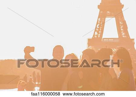 Friends taking selfie with smartphone View Large Photo Image Stock Photo - Friends taking selfie with smartphone. Fotosearch