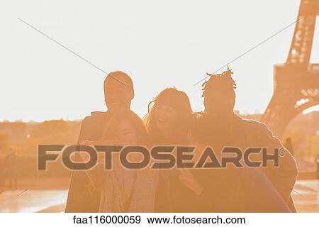 Stock Photo - Friends taking selfie with smartphone. Fotosearch