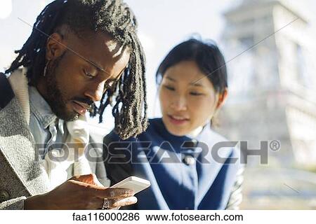 Stock Photograph - Friends traveling together in boat. Fotosearch
