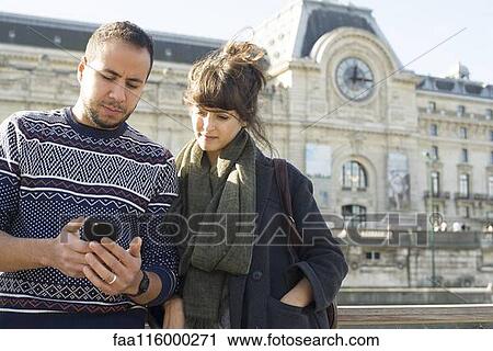 Friends using smartphone in boat View Large Photo Image Stock Image - Friends using smartphone in boat. Fotosearch