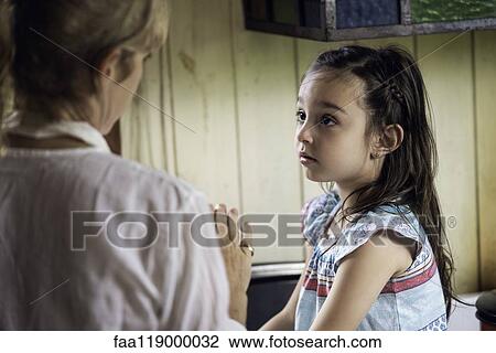 Girl talking with her grandmother View Large Photo Image Stock Image - Girl talking with her grandmother. Fotosearch