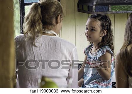 Girl talking with her grandmother View Large Photo Image Stock Image - Girl talking with her grandmother. Fotosearch