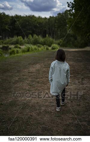 Girl walking outdoors View Large Photo Image Stock Image - Girl walking outdoors. Fotosearch
