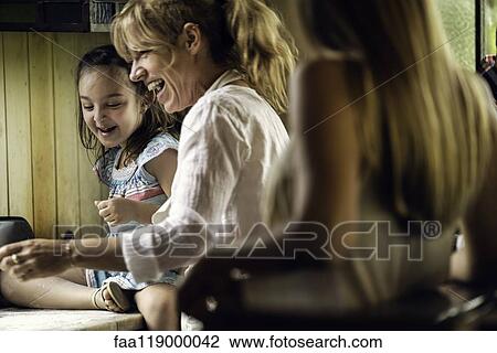 Happy family in kitchen View Large Photo Image Stock Image - Happy family in kitchen. Fotosearch