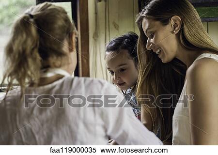 Stock Photography - Happy family in kitchen. Fotosearch