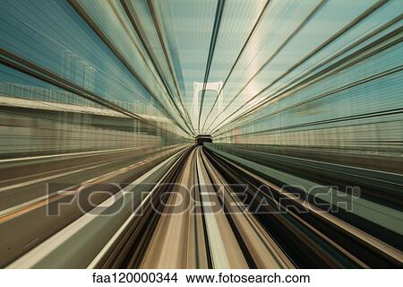 High speed train moving in city View Large Photo Image Picture - High speed train moving in city. Fotosearch