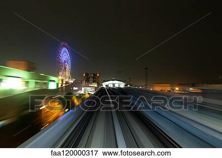 High speed train moving in city View Large Photo Image Stock Photo - High speed train moving in city. Fotosearch