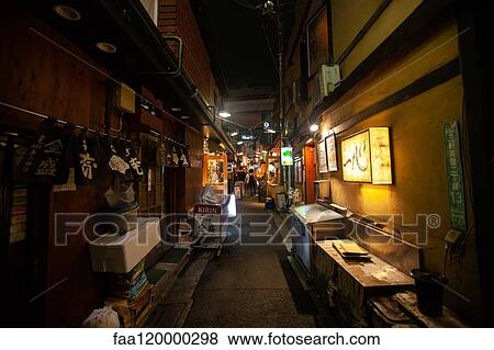 Illuminated signs of restaurant and shops at night View Large Photo Image Stock Photo - Illuminated signs of restaurant and shops at night. Fotosearch