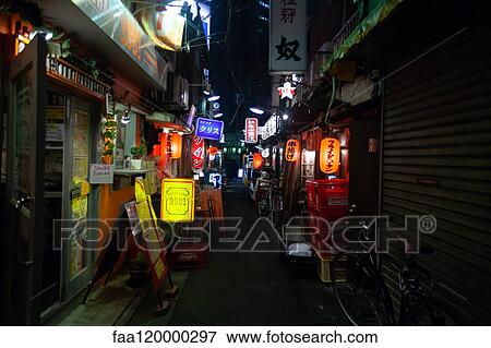 Illuminated signs of shops and bar at night View Large Photo Image Stock Photo - Illuminated signs of shops and bar at night. Fotosearch