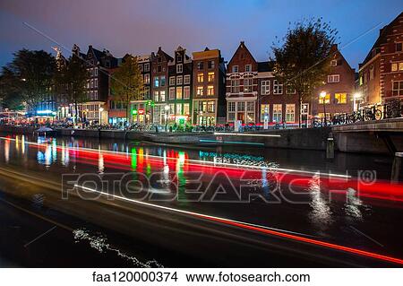 Light trials of boats along the canal View Large Photo Image Picture - Light trials of boats along the canal. Fotosearch