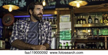 Man leaning against bar counter View Large Photo Image Stock Image - Man leaning against bar counter. Fotosearch