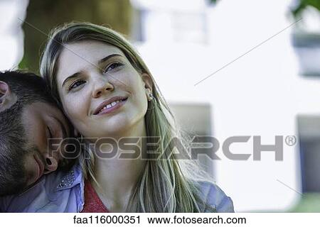 Man relaxing on the woman's shoulder View Large Photo Image Stock Image - Man relaxing on the woman's shoulder. Fotosearch
