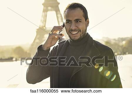 Stock Photography - Man talking on smart phone. Fotosearch