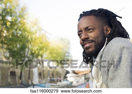 Stock Photo - Man traveling in boat. Fotosearch
