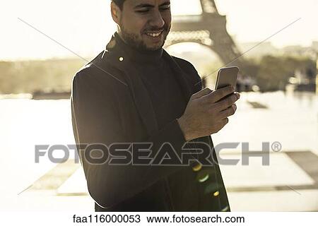 Man using smart phone View Large Photo Image Stock Image - Man using smart phone. Fotosearch
