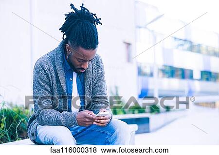 Man using smartphone View Large Photo Image Stock Photo - Man using smartphone. Fotosearch