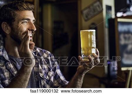 Man with beer mug showing a hand sign View Large Photo Image Stock Image - Man with beer mug showing a hand sign. Fotosearch