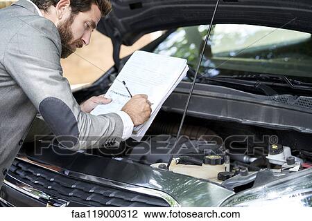 Man writing on documents View Large Photo Image Stock Image - Man writing on documents. Fotosearch