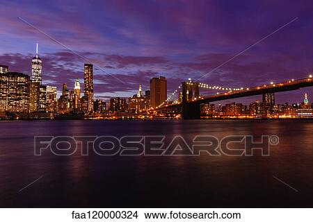 Manhattan skyline and Brooklyn Bridge at dusk View Large Photo Image Picture - Manhattan skyline and Brooklyn Bridge at dusk. Fotosearch