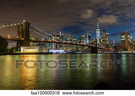 Manhattan skyline and Brooklyn Bridge at dusk View Large Photo Image Stock Photo - Manhattan skyline and Brooklyn Bridge at dusk. Fotosearch