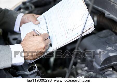 Man's hand writing on documents View Large Photo Image Stock Photograph - Man's hand writing on documents. Fotosearch