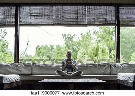 Mature woman having coffee at home View Large Photo Image Stock Photo - Mature woman having coffee at home. Fotosearch