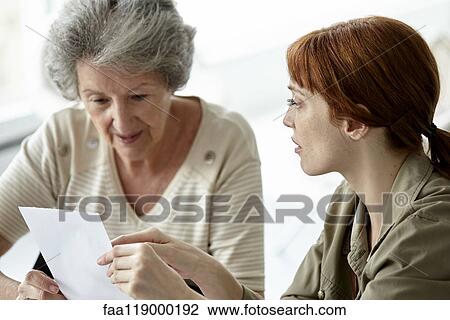 Mother and daughter discussing over prescription View Large Photo Image Stock Image - Mother and daughter discussing over prescription. Fotosearch