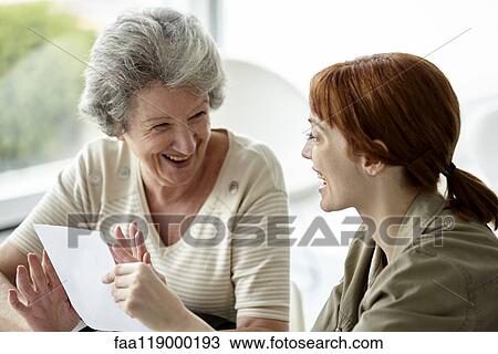Mother and daughter holding prescription View Large Photo Image Stock Image - Mother and daughter holding prescription. Fotosearch